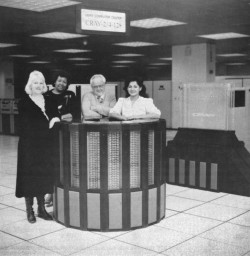 Photo of people standing around Cray-2 supercomputer
