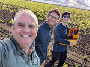 Three men in a field